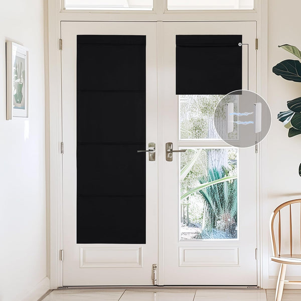Black magnetic blackout shades on white French doors. Partially open, showing magnetic attachment.