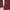 Deep maroon curtains with a modern white abstract wavy line pattern hanging by a window.