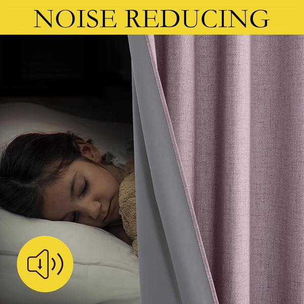 Textured mauve noise reducing curtains with grey backing next to a sleeping child in a dark bedroom.