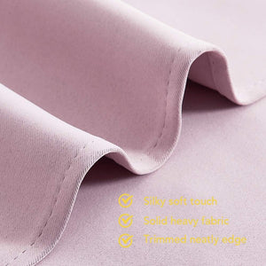 Mauve fabric close-up showing silky soft texture, neatly stitched solid heavy edge, and gentle drapes.