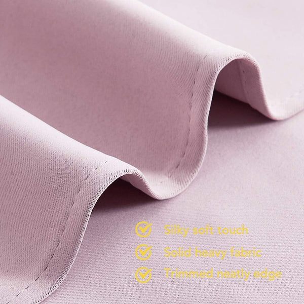 Mauve fabric close-up showing silky soft texture, neatly stitched solid heavy edge, and gentle drapes.