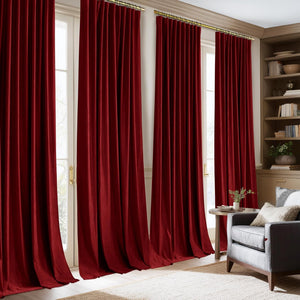 Luxurious merlot velvet pinch pleat curtains with gold rings hang elegantly over tall windows.