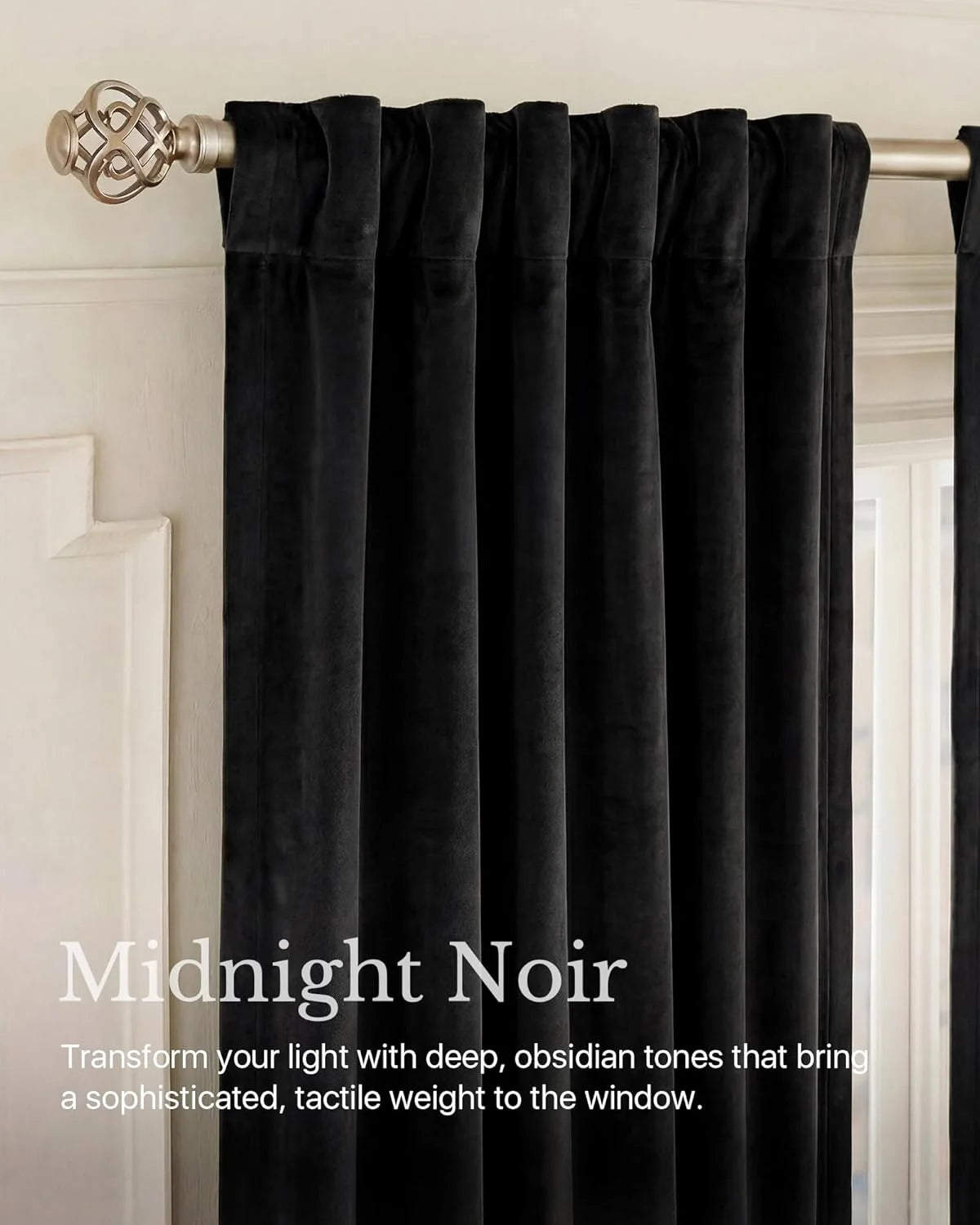 Midnight black velvet curtains with rod pocket pleats on a brushed metal curtain rod