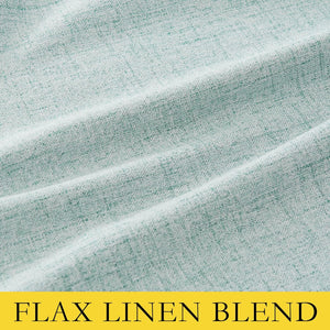 Close-up of a light mint green heathered flax linen blend fabric with visible woven texture and soft folds.