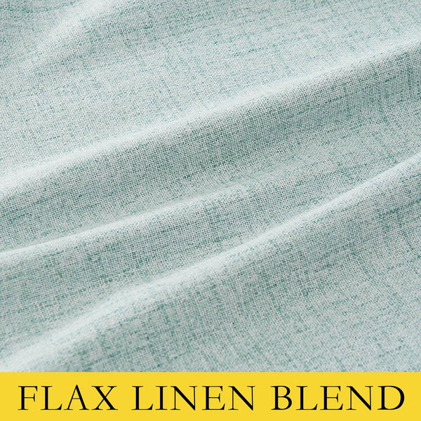 Close-up of a light mint green heathered flax linen blend fabric with visible woven texture and soft folds.