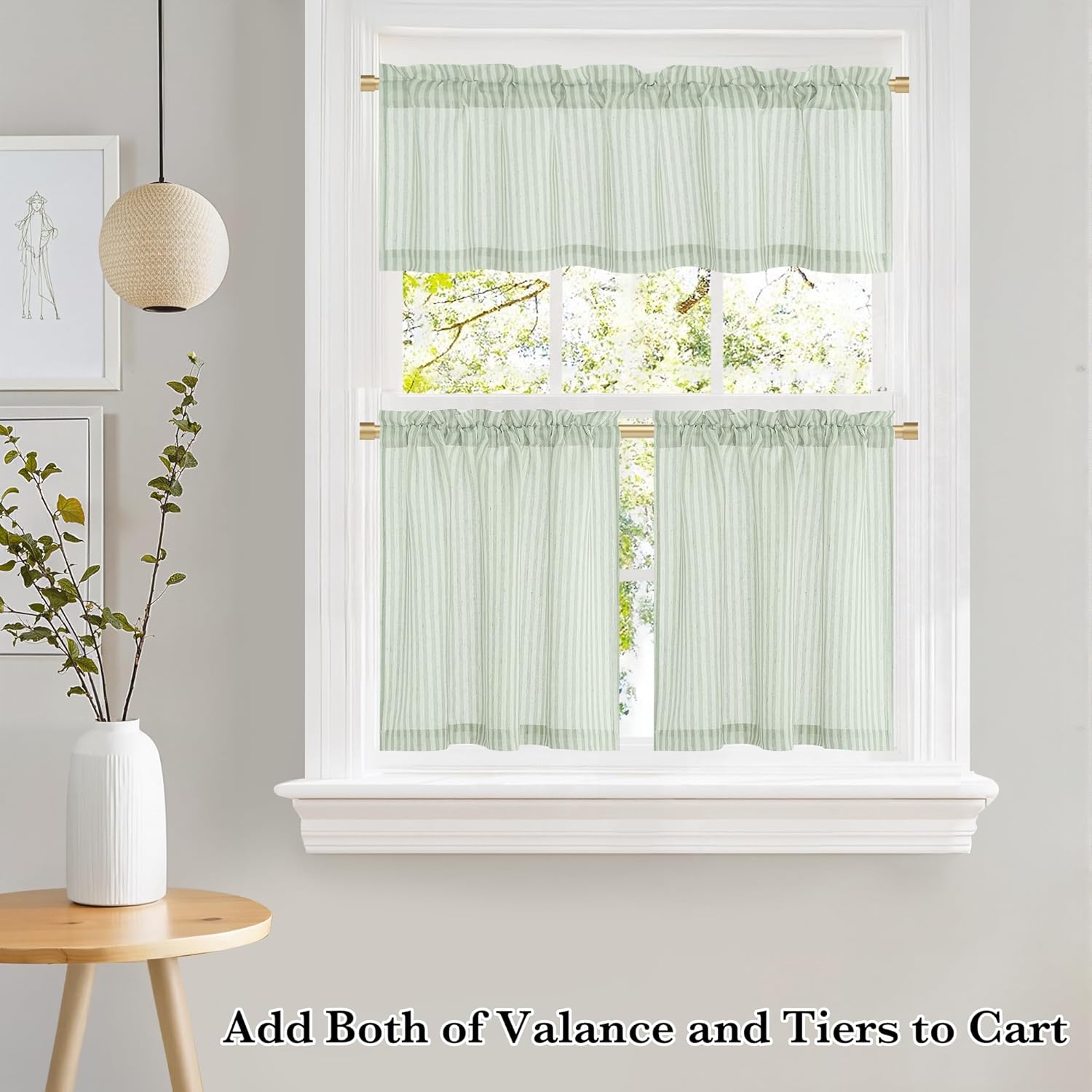 Mint green and white striped valance and tier window curtains with rod pocket top, hung on a brass rod.