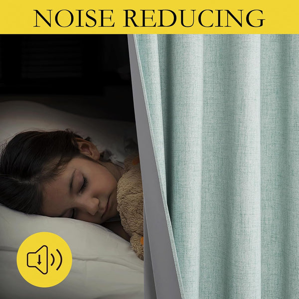 Mint green textured noise reducing curtain next to a child sleeping soundly in a dark room.