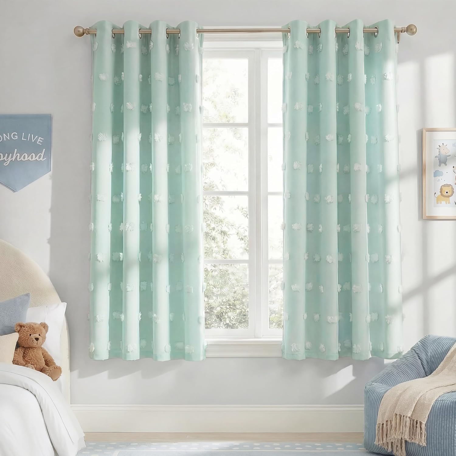 Mint green sheer curtains with white tufted dots and grommet top, hanging in a bright nursery.