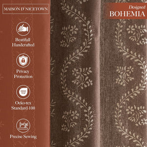 Close-up of a brown bohemian-style curtain with a delicate cream floral vine pattern and textured fabric.