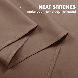 Detailed view of mocha brown curtain fabric, highlighting neat double-stitched hem and fine weave.