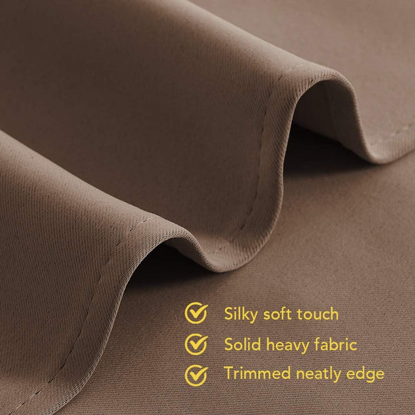 Close-up of mocha brown fabric, featuring a silky soft touch, solid heavy quality, and neatly trimmed edge.
