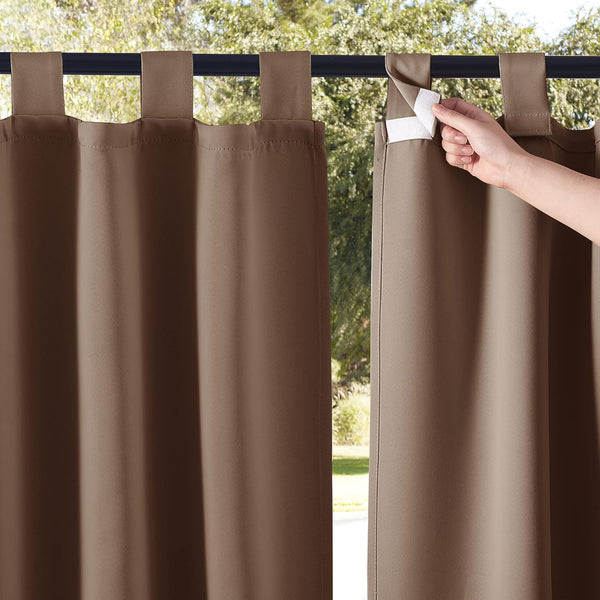 Mocha brown outdoor curtains with hook and loop tab tops. A hand shows the adjustable Velcro closure.