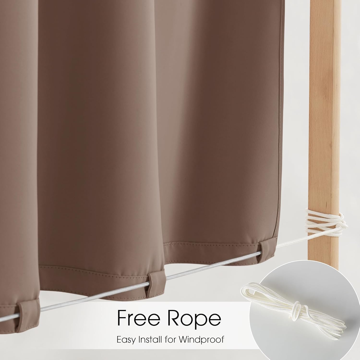 Mocha brown outdoor curtains with white windproof rope threaded through bottom loops, tied to a wood post.