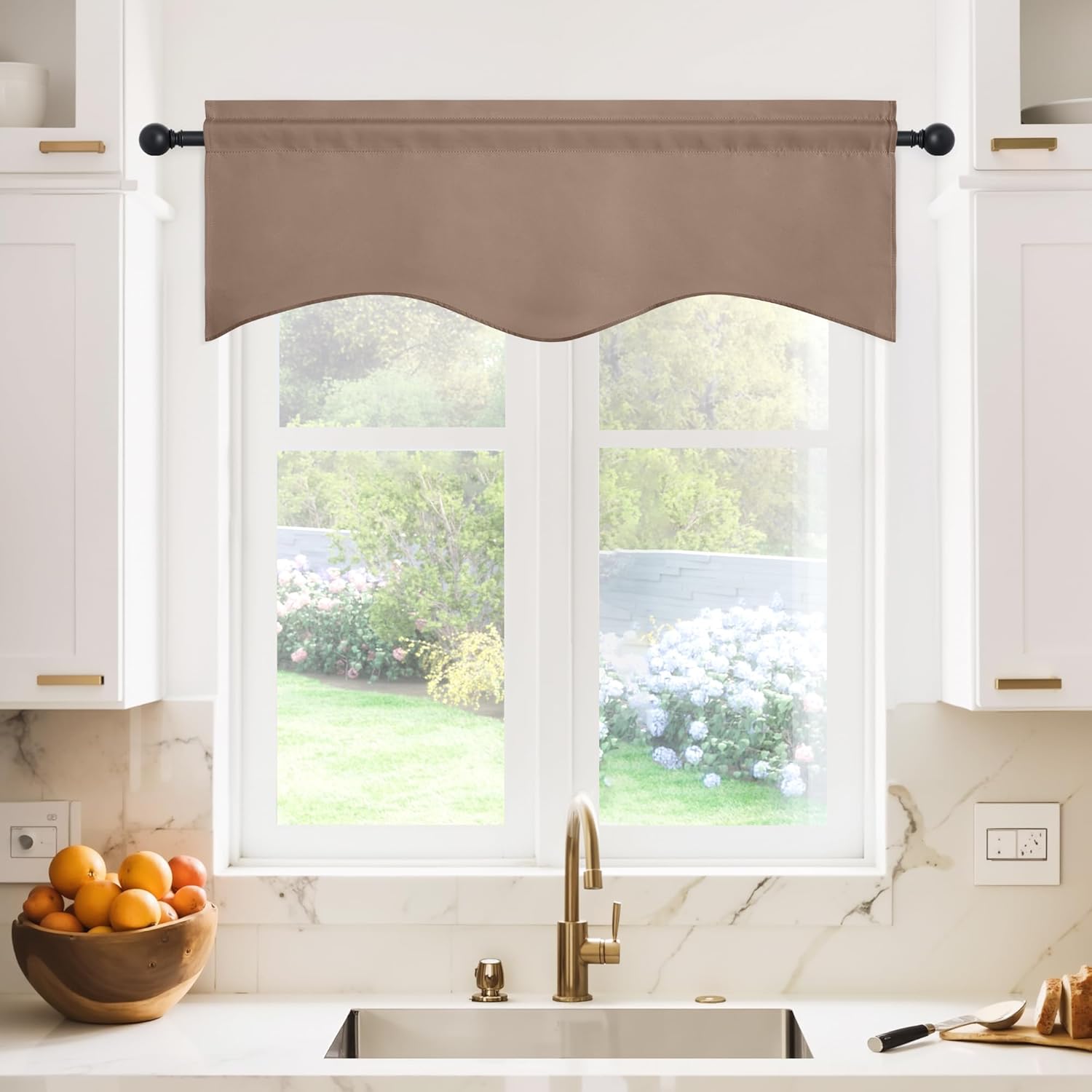 Mocha brown fabric valance with a scalloped bottom edge and rod pocket, hanging over a kitchen window.
