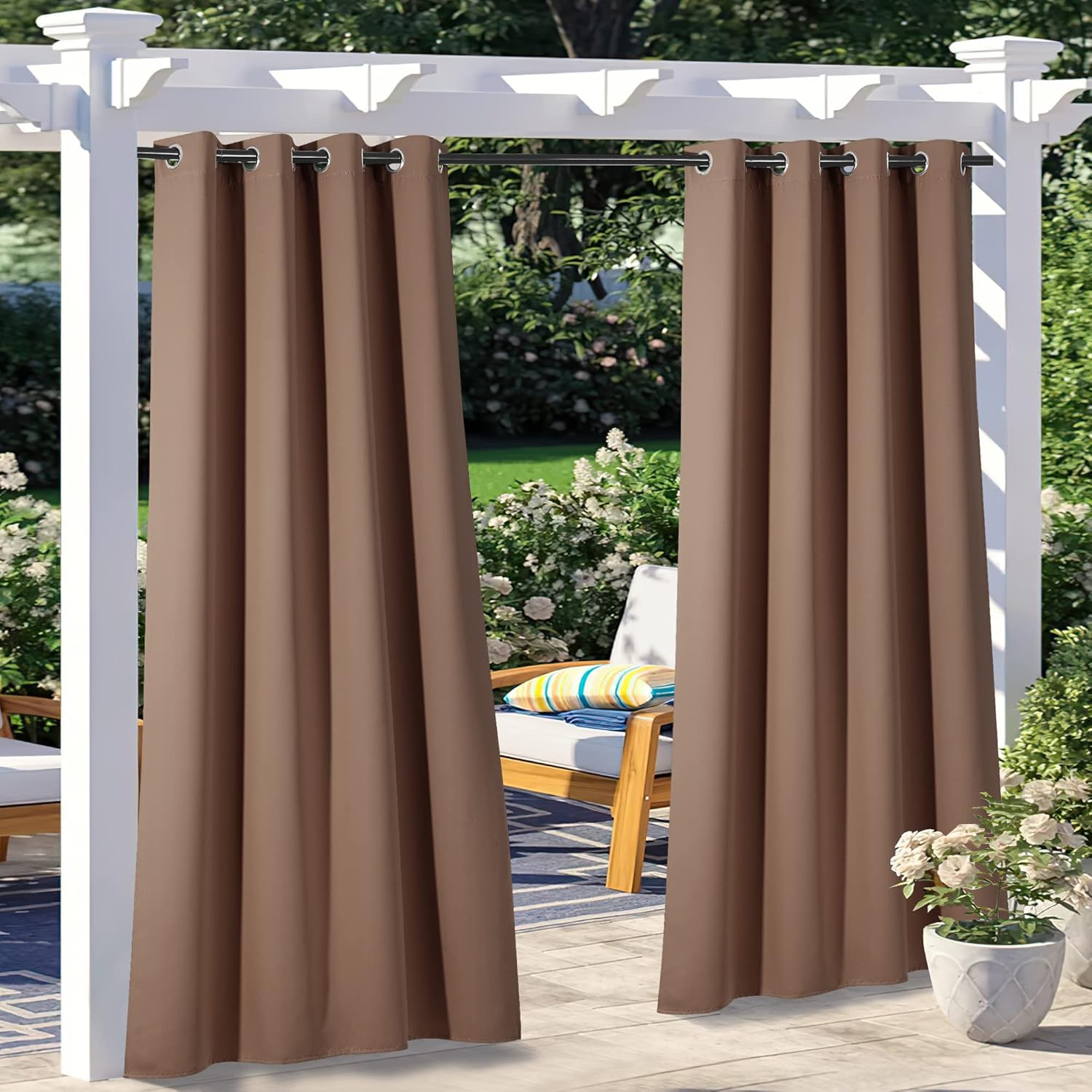 Mocha outdoor grommet curtains hanging from a white pergola, providing shade and privacy for a patio.