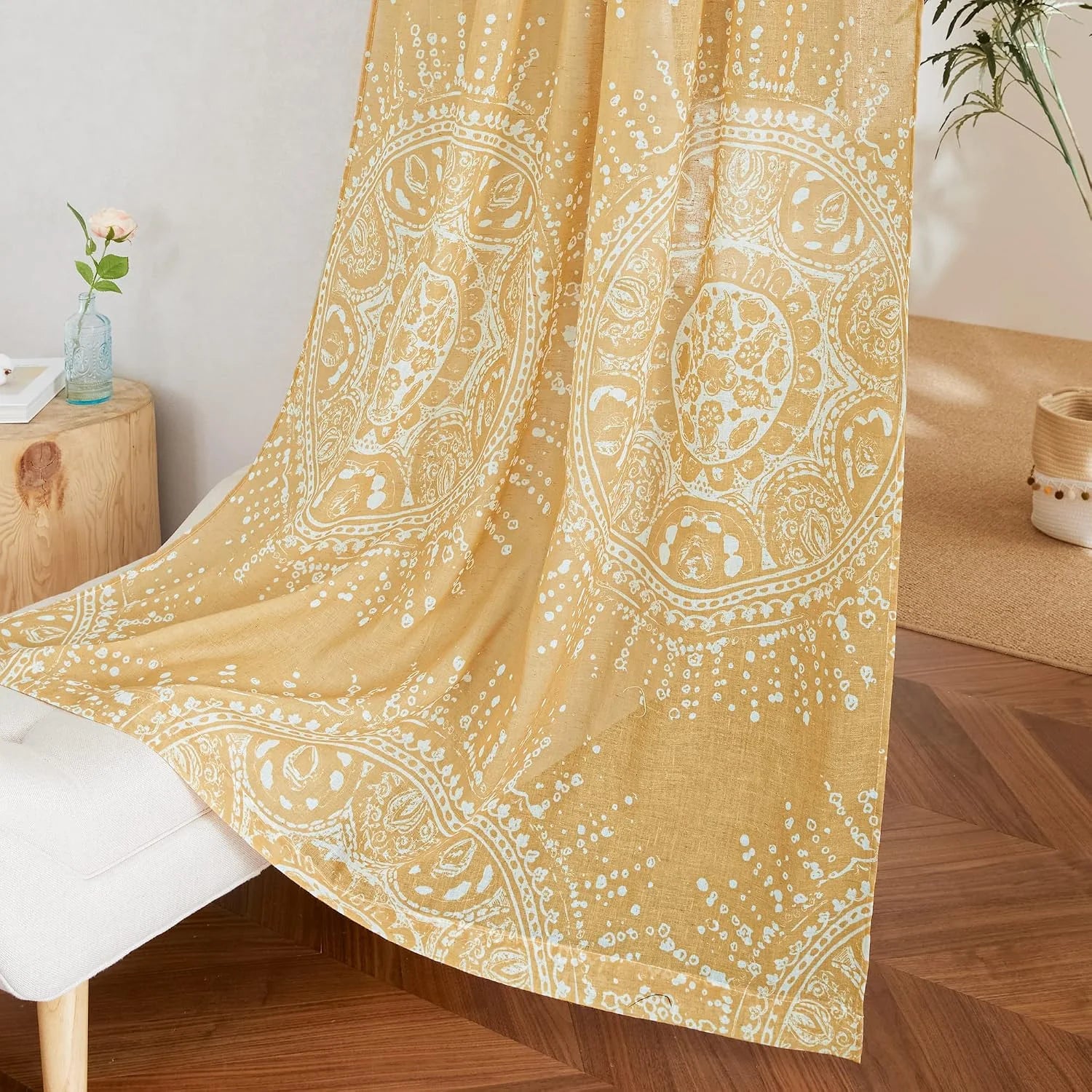 Mustard yellow boho linen curtain with white medallion print draped in a cozy room