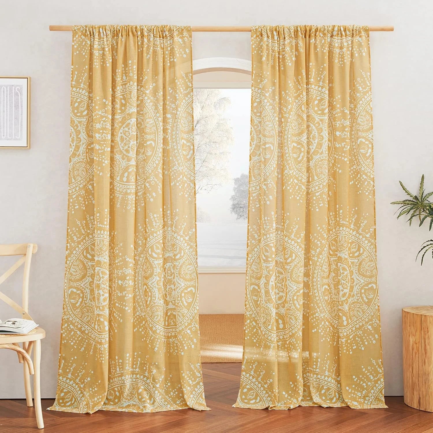 Mustard yellow sheer curtains with white mandala print in a bright boho room