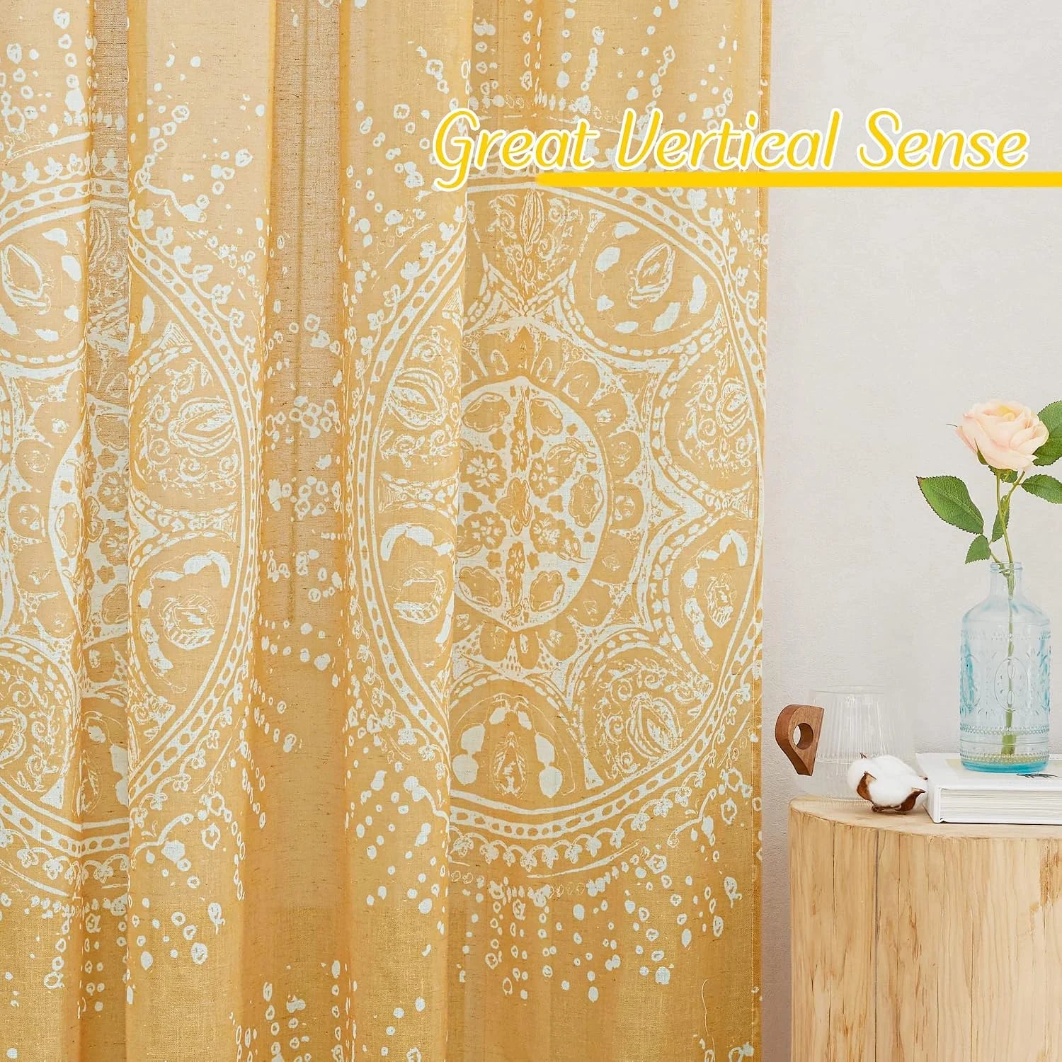 Mustard yellow boho printed curtain with white medallion pattern beside wood table