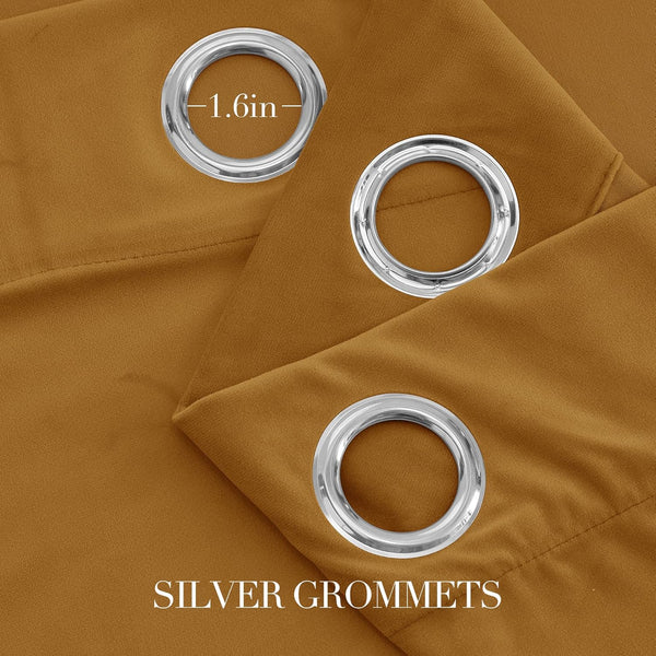 Close-up of mustard brown blackout curtain fabric with three shiny silver grommets, showing a 1.6 inch inner diameter.