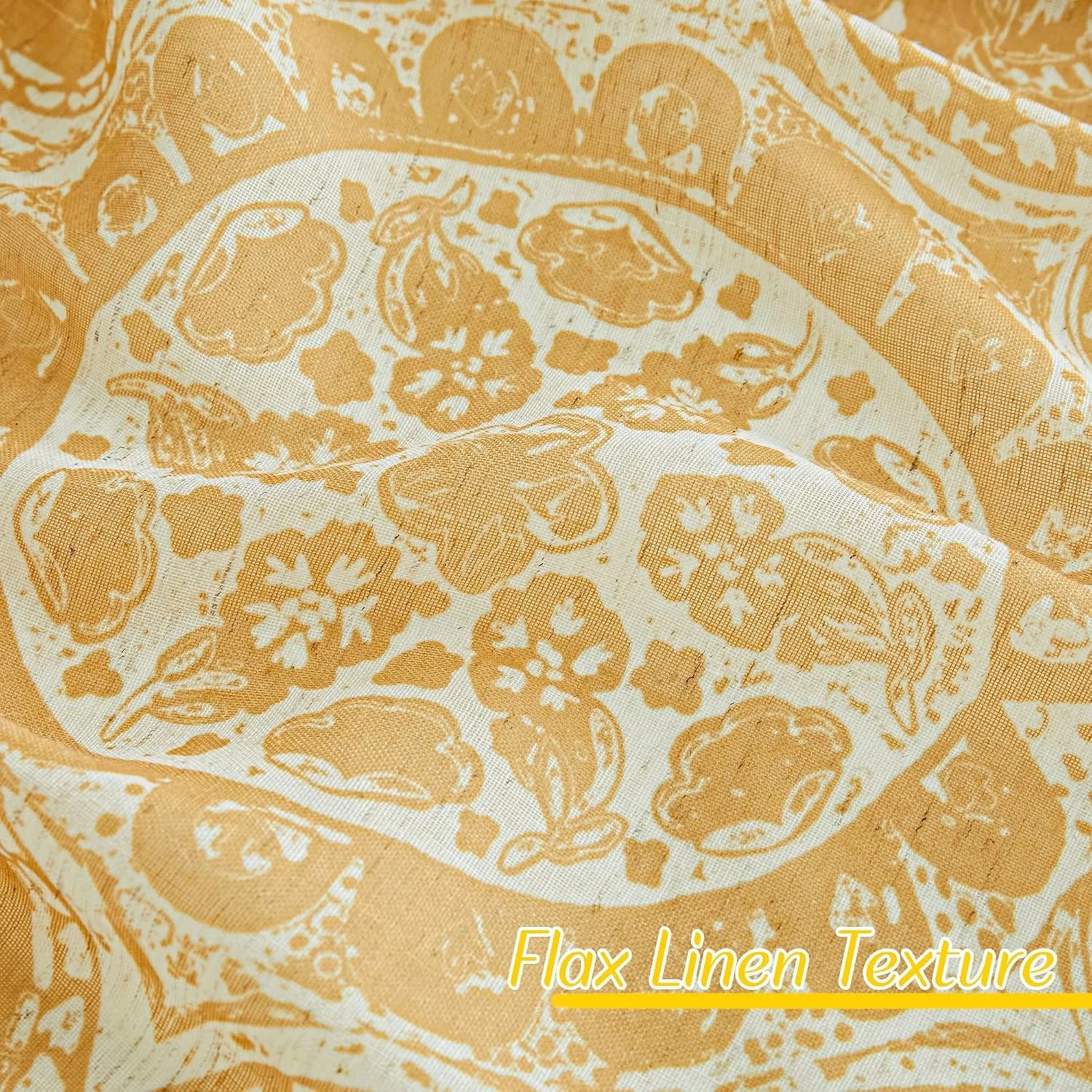 Close-up of mustard yellow and white paisley fabric with visible flax linen texture