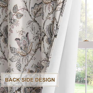 Muted gray and pink floral chinoiserie patterned curtain, showing its elegant front and plain white back lining by a window.