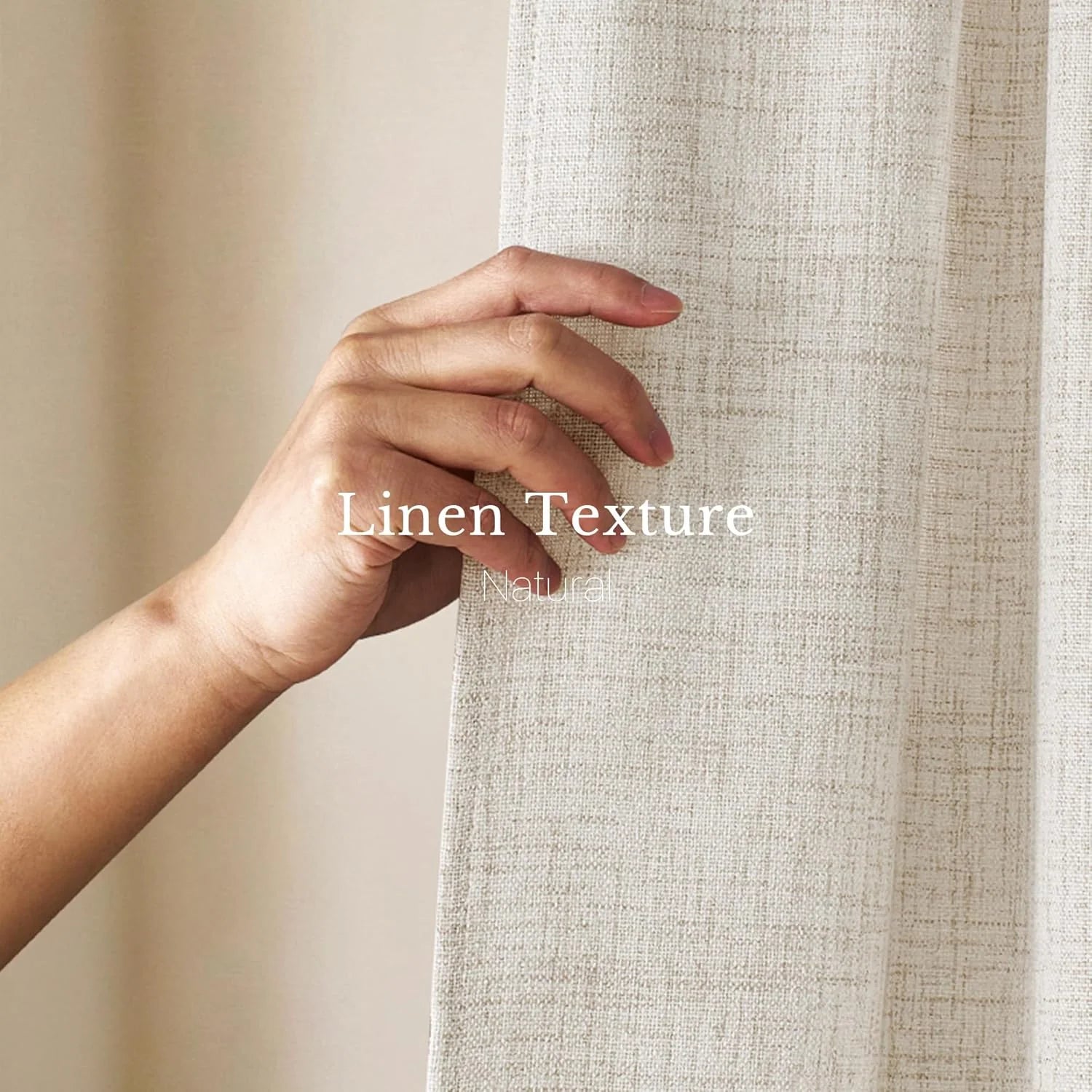 Hand gently touching a natural light beige linen curtain, showcasing its woven texture.