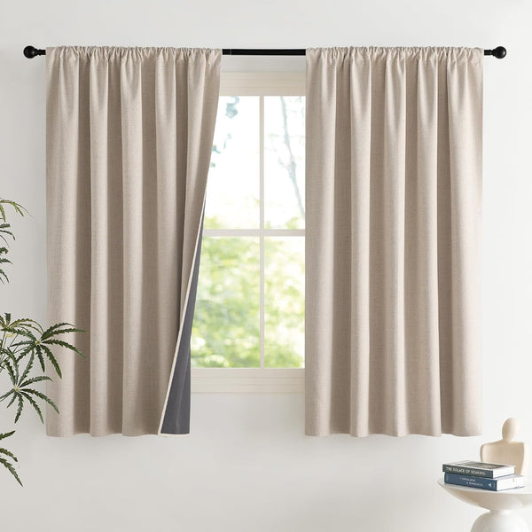 Beige linen-textured curtains with gathered rod pocket top, showing dark gray blackout lining.
