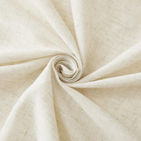 Close-up of natural cream linen blend fabric with a visible slub texture, folded into a gentle swirl.
