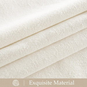 Close-up of natural cream textured linen-blend fabric with visible slubs, folded showing its soft drape.