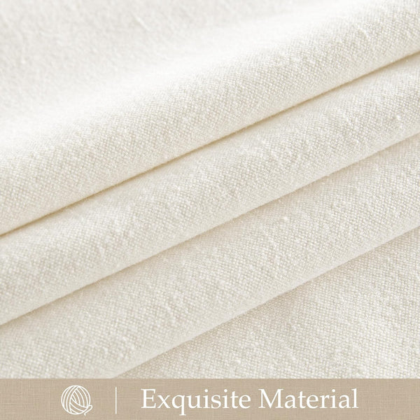Close-up of natural cream textured linen-blend fabric with visible slubs, folded showing its soft drape.