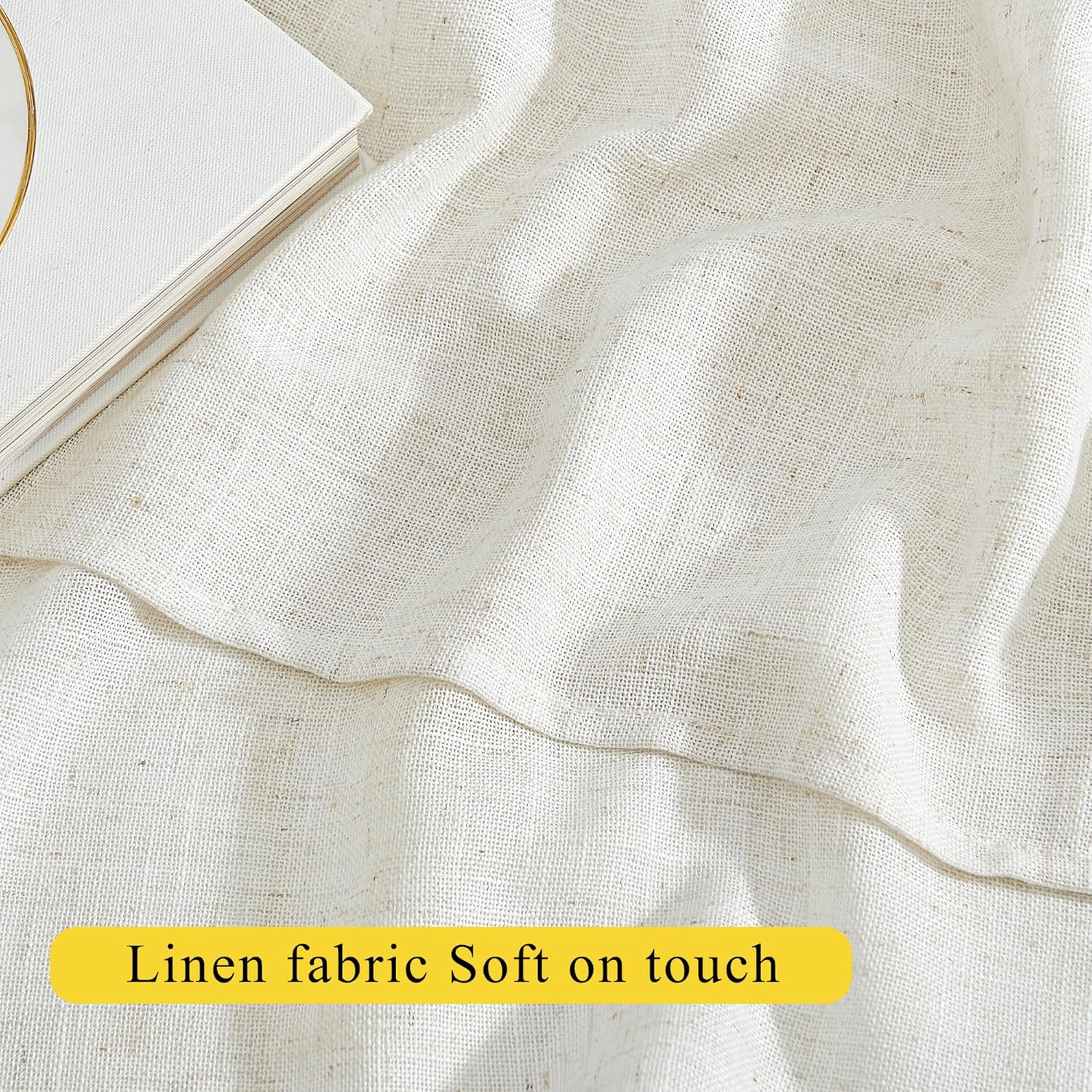 Close-up of soft, natural ecru linen fabric with a visible woven texture, appearing soft on touch.