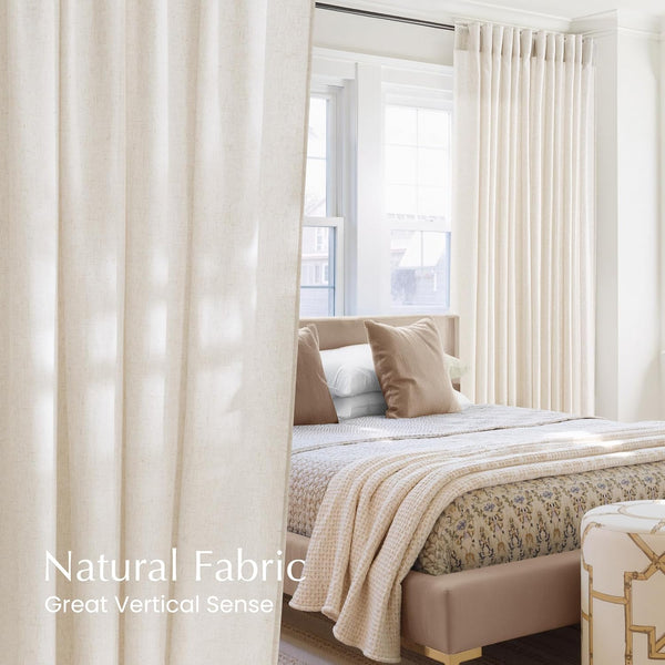 Light beige natural fabric pleated curtains with subtle texture hanging in a bright modern bedroom.