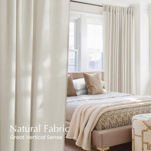 Off-white natural fabric pleated curtains framing a sunny bedroom window.