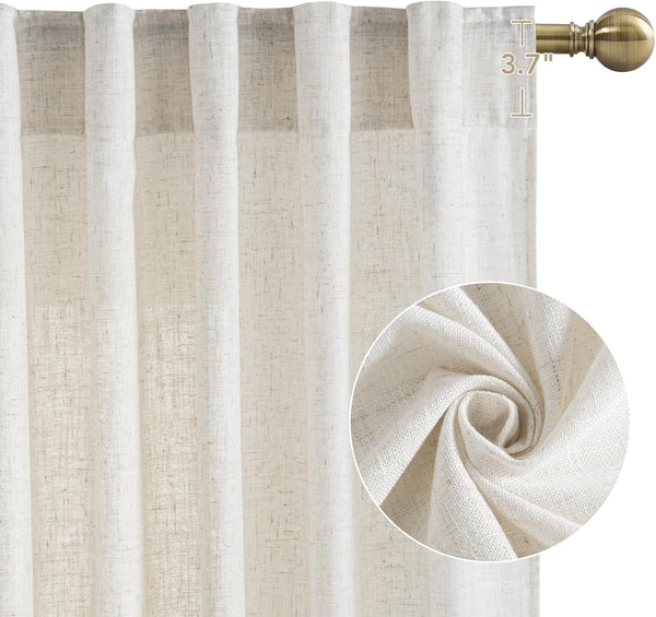Light beige linen back tab curtains with a textured weave, hanging on a brass rod.