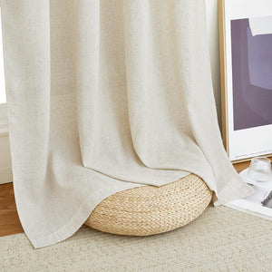 Natural light beige linen-blend textured curtains, softly draped over a woven stool on a light rug.