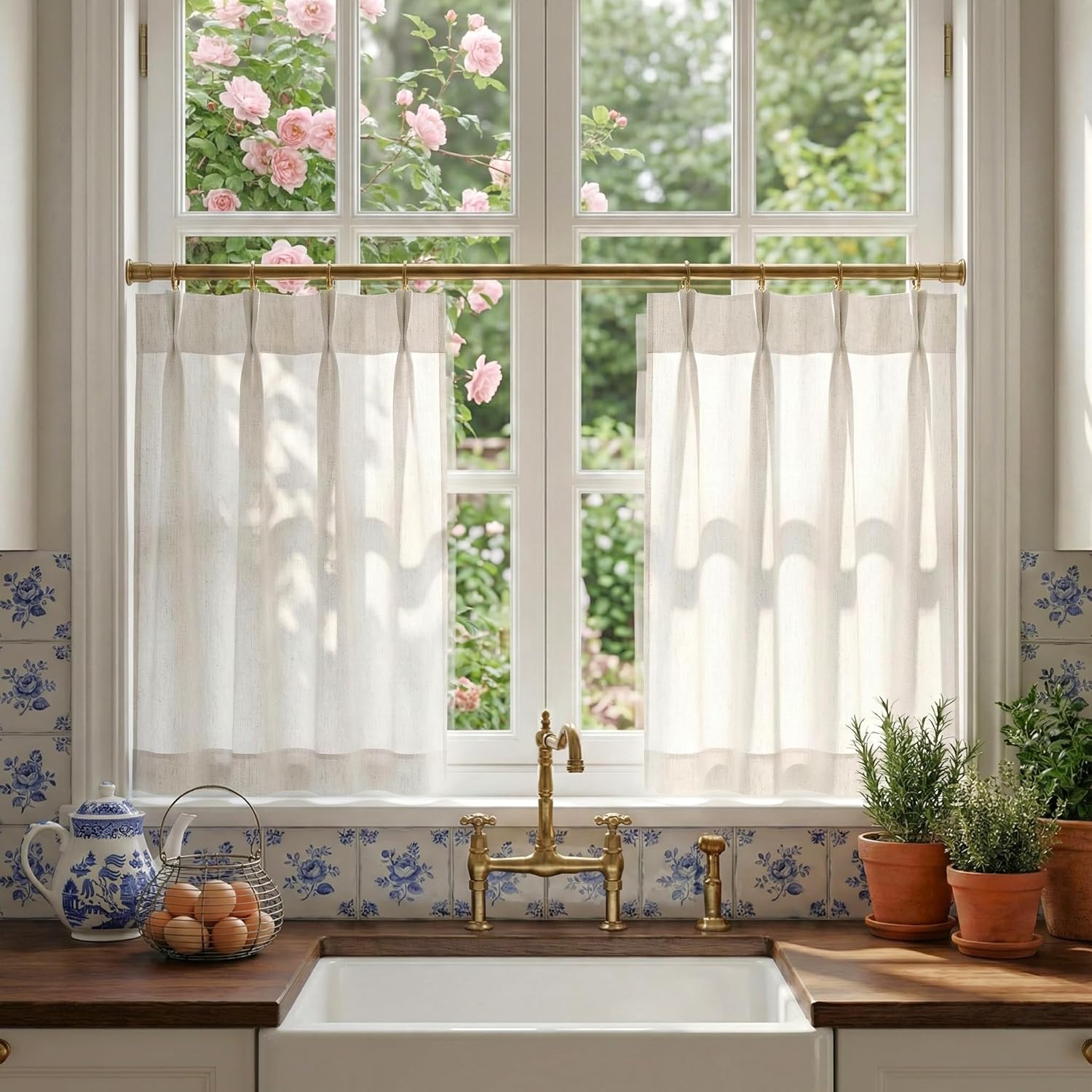 Natural linen cafe curtains on brass rod in a farmhouse kitchen, offering privacy and light.