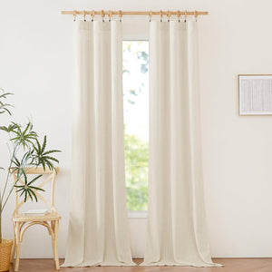 Natural linen light filtering curtains hung with wooden clip rings on a rod, showing off-white textured fabric.