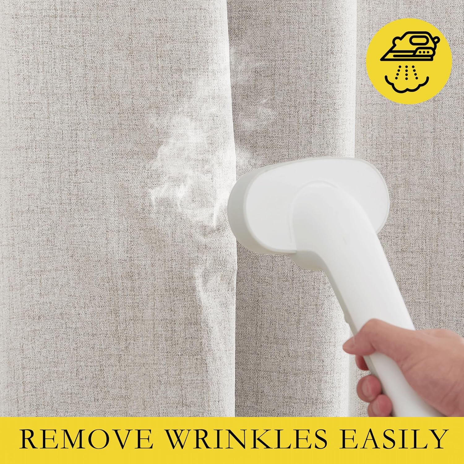 Close-up of a hand using a white garment steamer to smooth wrinkles from a light beige textured drape.