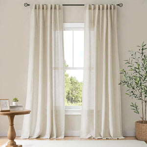 Pair of light beige natural linen-look window curtains with a pleated header, softly filtering sunlight.