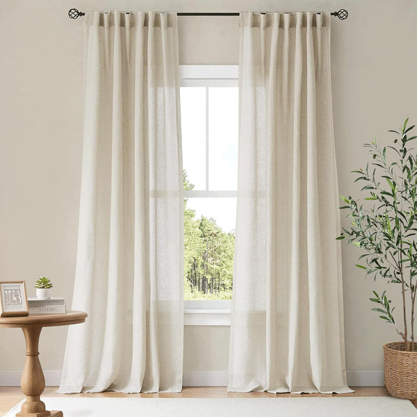 Pair of light beige natural linen-look window curtains with a pleated header, softly filtering sunlight.