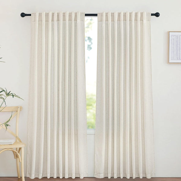 Pair of natural linen-look pleated curtains hanging from a black rod, diffusing light through a window.