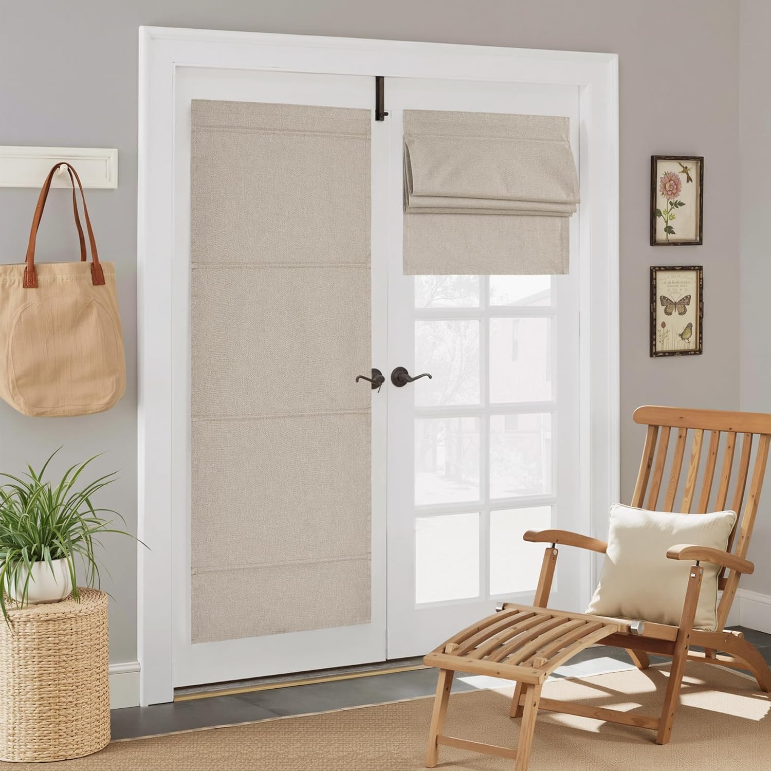 Natural linen textured Roman shades mounted on white French doors, one extended and one raised.