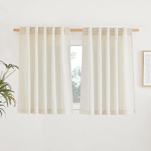 Natural light beige linen tab top cafe curtains with visible texture, hanging on a wooden rod over a window.