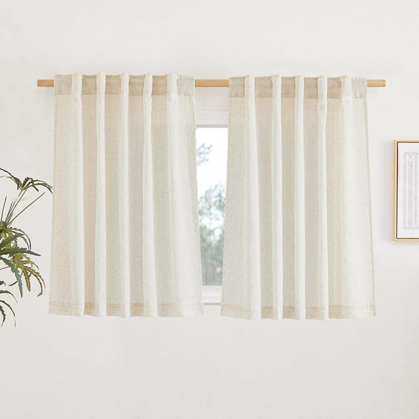 Natural light beige linen tab top cafe curtains with visible texture, hanging on a wooden rod over a window.