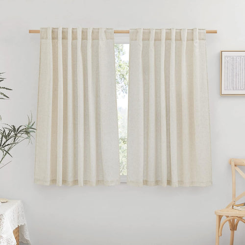 Two natural linen-blend tab top curtains provide soft light filtering over a window on a wooden rod.