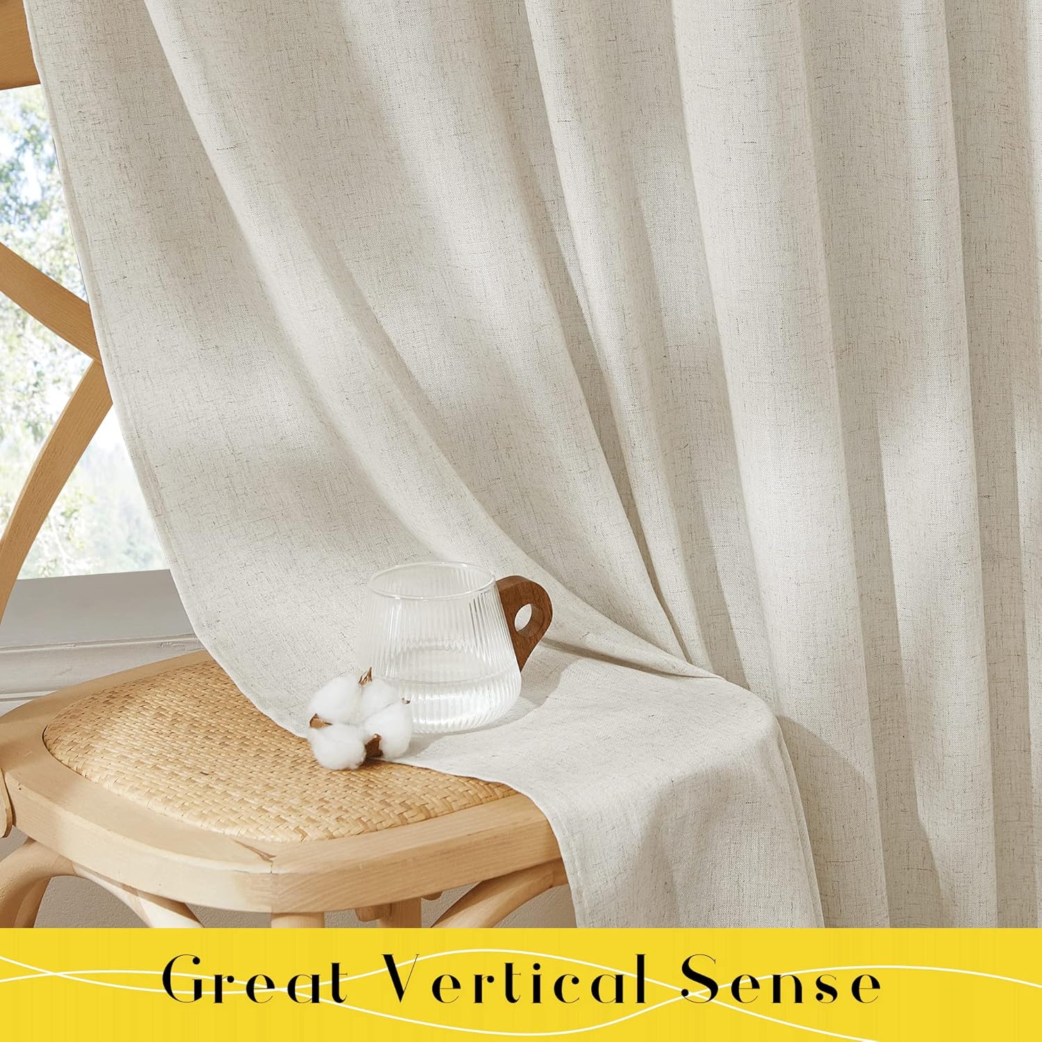 Textured light beige linen-blend curtains draped gracefully over a wooden chair by a sunny window.