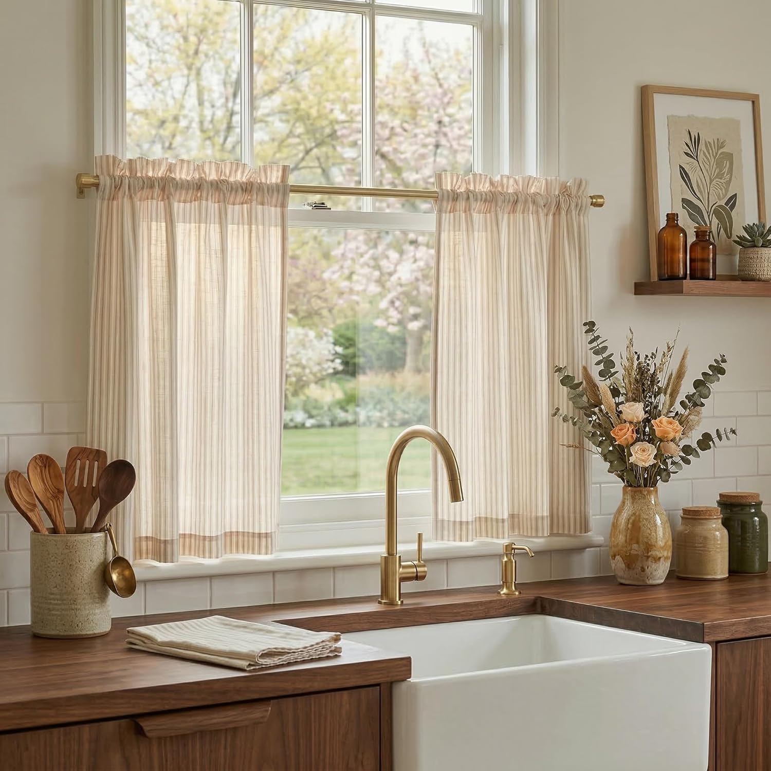 Natural striped sheer cafe curtains with a ruffled rod pocket in a bright kitchen.