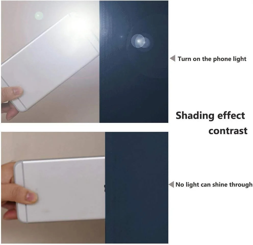 Phone flashlight behind navy blackout curtain fabric showing no light passing through