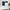 Navy blue blackout door window shades on white french doors, one full panel, one tie-up roman.