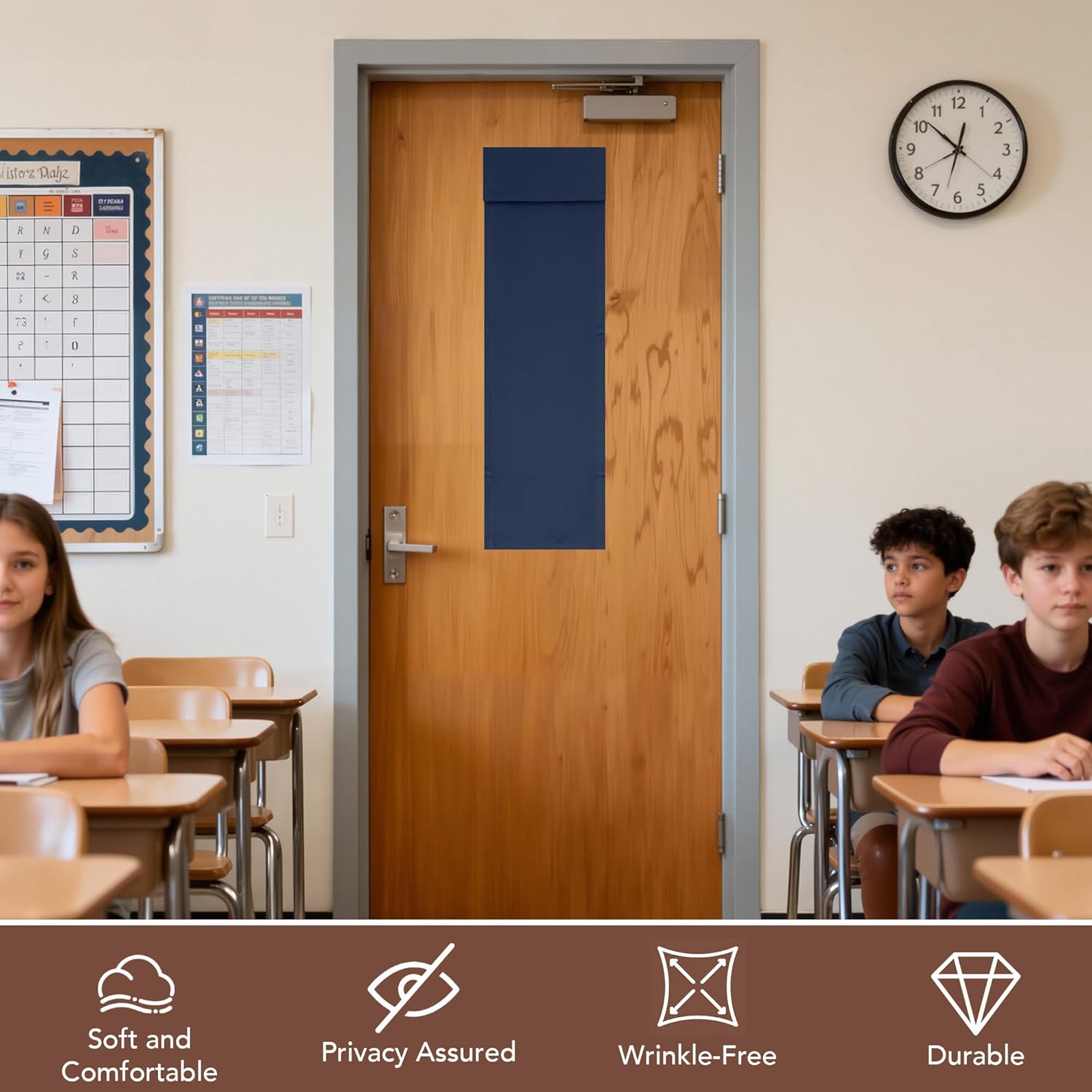 Navy blue fabric privacy panel covering the window on a light wooden classroom door, with students visible at desks.